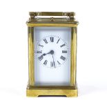 A French brass-cased carriage clock with repeat movement striking on a gong, case height 11cm,