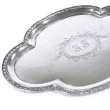 A German silver tray, lobed oval form with pierced scroll border and engraved floral bow centre,