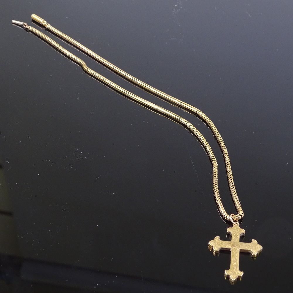 An unmarked gold cross pendant necklace, on 9ct snake-link chain, floral engraved cross, pendant - Image 2 of 4