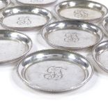 A set of 10 Finnish silver drinking coasters, beaded borders, diameter 7.5cm, 5.3oz All in very good