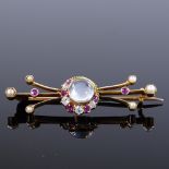 A Victorian 15ct gold moonstone ruby diamond and pearl crescent moon and shooting star brooch,