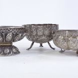 3 Indian unmarked silver bowls, with relief embossed and pierced decoration, largest diameter 9cm,