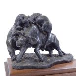 A large carved soapstone sculpture depicting lions attacking a buffalo, mounted on wooden plinth,