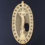 An 18th century Dieppe ivory plaque depicting the crucifixion, height 15.5cm Large hole in the