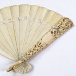 A 19th century Dieppe ivory Brise fan, with carved and pierced dove decorated guard Guard is