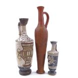 A group of terracotta Antiquities, comprising a tall narrow flask, height 30cm, and 2 Greek ewers