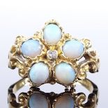 An 18ct gold cabochon opal and diamond cluster flowerhead ring, pierced and engraved scrollwork