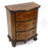 A 19th century French walnut serpentine-front chest of drawers of small size, with inlaid