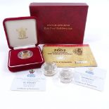 A 2002 proof gold half sovereign, and 2 Guernsey silver proof £1 coins (3)