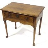 An 18th century oak lowboy with single frieze drawer, width 31"