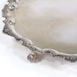 A large Elizabeth II circular silver salver, scalloped edge with bead and leaf border and acanthus