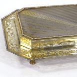 An Art Deco unmarked silver and silver-gilt desk cigarette box, engine turned brick and stripe lid