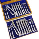 An Edwardian 12-place silver dessert cutlery set, comprising silver-handled pistol-grip knives and