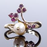 A 9ct gold ruby and cultured pearl floral ring, maker's marks EF, hallmarks London 1987, setting