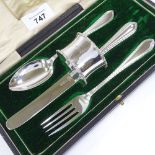 A George V single place silver cutlery set, comprising fork, knife, spoon and napkin ring, by Cooper