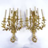 A pair of gilt-bronze 5-branch wall light fittings, decorated with Pan masks, probably circa mid-
