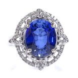 A 14ct white gold sapphire and diamond cluster ring, oval-cut sapphire approx 4.5ct, pierced