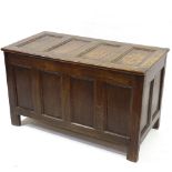 An 18th century panelled oak coffer, width 3'5"