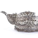 An early 20th century Dutch silver bread basket, pierced fretwork with 2 cast-silver ribbon bow