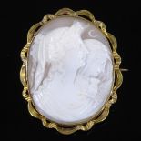 A Victorian relief carved cameo shell panel brooch, depicting Greek goddesses Eos and Nyx, in