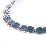 A Mexican sterling silver and turquoise enamel Aztec necklace, maker's marks SM, possibly Serafin
