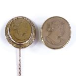 A Victorian unmarked rose gold relief carved lava cameo stick pin, foliate engraved surround,