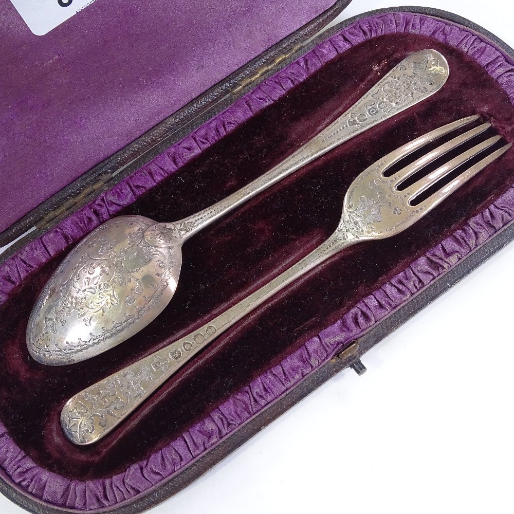 A silver cutlery set, comprising fork and spoon with bright-cut engraved decoration, hallmarks