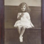 A large format late 19th century photographic portrait of a child, in original frame and glazed,