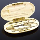 A Victorian ivory sewing etui, the interior fitted with silver-gilt accoutrements, length 11cm Lid