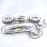 A Limoges porcelain fish service for 12 people, with hand painted and gilded decoration, including a