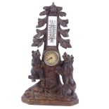 A 19th century Black Forest desk clock/thermometer, in the form of 2 bears climbing a tree, height
