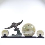 An Art Deco 2-colour onyx and marble clock garniture surmounted by a bronze patinated spelter