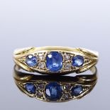 An 18ct gold 7-stone sapphire and diamond ring, shaped boat style setting, indistinct marks, setting