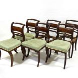 A set of 6 George III Irish mahogany dining chairs, with carved and fluted back rails, and sabre