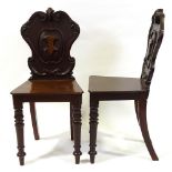 A pair of Victorian mahogany hall chairs with shield-shaped backs