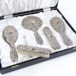 An Elizabeth II 5-piece silver-backed dressing table set, comprising hand mirror and brushes, high
