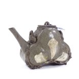 A Chinese glazed terracotta teapot with slip text inscription, height 14cm Tiny chip on the foot,