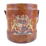 A large leather-bound bucket, with leather swing handle and transfer printed armorial crest Aimez