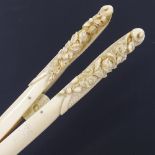 A pair of 19th century ivory glove stretchers, with relief carved floral handles, length 22cm