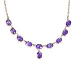 A 9ct gold amethyst line collar necklace, necklace length 45cm, 11.4g Very good overall condition,
