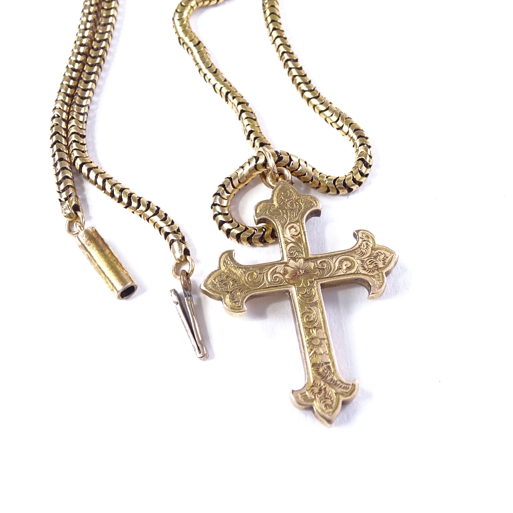 An unmarked gold cross pendant necklace, on 9ct snake-link chain, floral engraved cross, pendant - Image 3 of 4