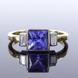 An 18ct white gold 3-stone tanzanite and diamond dress ring, total diamond content approx 0.15ct,