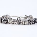 A Pandora silver charm bracelet, 12 charms and a double ended security chain, bracelet length