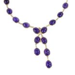 A modern unmarked gold cabochon amethyst line negligee necklace, with 2 graduated drops, unmarked