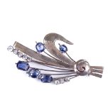 A 1960s unmarked white metal blue and white sapphire floral spray brooch, brooch length 50.8mm, 5.6g