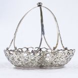 An Edwardian silver clover basket, pierced border with domed handle, by Goldsmiths & Silversmiths Co