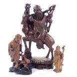 3 Chinese wood carvings, circa 1900, largest height 35cm Largest figure has a crack at the front