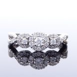 An 18ct white gold diamond halo triple-cluster ring, total diamond content approx 0.6ct, setting