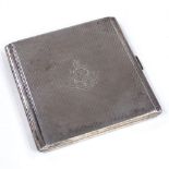 A George V Art Deco square silver cigarette case, stepped edges with engine turned decoration and