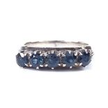 An 18ct white gold 5-stone sapphire half-hoop ring, openwork shoulders and bridge, setting height